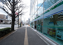 You will see a building with a FamilyMart to your right.